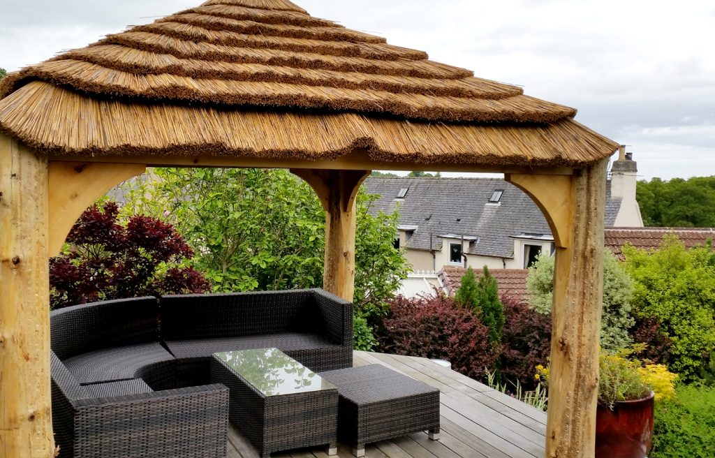 thatched gazebo with views roundwood timber framing